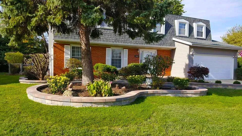 Front yard retaining wall with lawn
