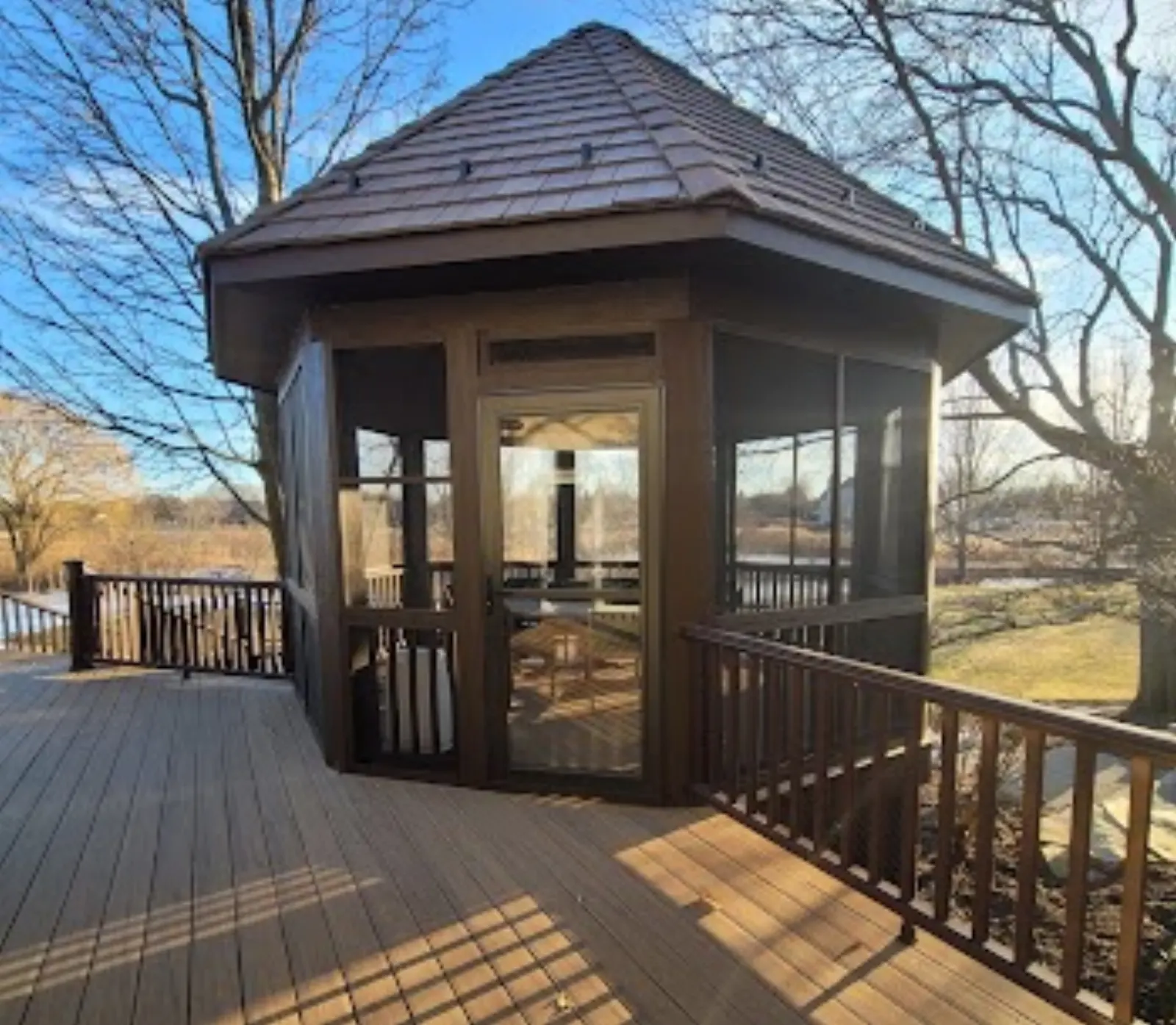 Screened gazebo on composite deck in winter